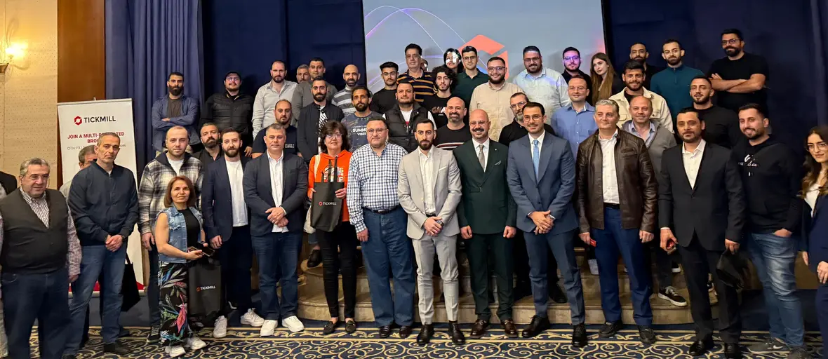 Audience and speakers at a trading event